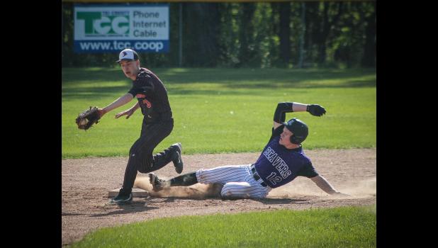 Eleva-Strum Brady Nichols snags this throw from his catcher as Augusta's Zander Harris slides into second. Photo courtesy of Eleva-Strum Cardinal Baseball Facebook Page