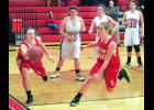 Kelsey Hartert makes a save here along the baseline and tries to steer the ball back inbounds to teammate Maggie Klees, right. The action is from the second half of last Tuesday’s win over Alma/Pepin. Looking on for the Eagles are Brilyn Brecka (30) and Hanna Peters (32). 