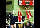 Tori Gaedtke (left) and Natalie Schmit try to block this spike by the Cardinals’ Maddy Mundt last week in the Lewiston-Altura match.
