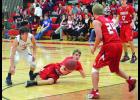 Connor Passe tries to save a loose ball for the Falcons, by shufling it off to teammate Ryan Wolfe (24) as A/P’s Tevor Heit looks on.