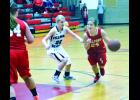 Adrianna Baab drives around Fillmore Central’s Tayah Barnes in first half action Tuesday night at the W-K Gym. 