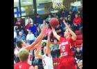 Zach Kjeseth fights for a rebound against Alma/Pepin’s Jonah Bacon during last week’s thrilling 71-69 overtime loss to the Eagles at the W-K Gym. 