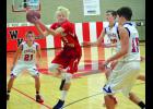 Leaping high for a second half rebound here is W-K’s Jaxon Mickow. Surrounding him are Alma/Pepin players Logan Carroll (21), Jacob Kirchner (10) and James Sterry (15). A/P prevailed in overtime, 71-69.