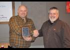 Rich Bauer (left) receiving the Mondovi Conservation Club's Member of the Year honor from club president Al Urness (right).