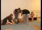 The Cadettes worked together to install planks of bamboo flooring over the existing stage. Once the group got its equipment functioning properly, the Scouts say the flooring project went fairly smoothly.