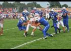 Sophomore Dustin Dziekan stopped an attempted G-E-T score just short of the goal line with help from Hunter Evans (89).