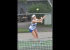 Junior Maria Jans grinned as she sent a hard shot back across the net.