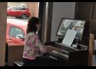 Volunteer Belinda Poeschel played a piano inside the store during the grand opening, providing background music and adding to the nostalgia for those who hadn’t set foot inside the building in many years.