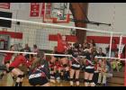 Senior Mackenzie Hutchins stretched back to find the volleyball before landing a kill in Gilmanton territory.  The Lady Cards won a hard-fought match against the Panthers last week, 3-2.