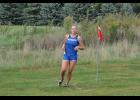 Senior Amanda Rud looked ahead as she worked her way through the middle of the girls’ race.