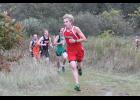 Isaiah Loewenhagen rounded a turn after climbing a short hill midway through the boys’ race.