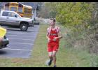 Logan Odell glanced around a turn while legging out the final mile of the boys’ race.