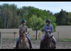 Kira Lee (right) gave teammate Emma Sandberg a few pointers at a recent skills clinic. The team organized multiple clinics to prepare for this month’s competition season, but much of the practice is left up to the individual rider.