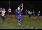 Senior Sawyer Hayes turned to catch a pass thrown by quarterback Greg Poeschel. Hayes and Poeschel connected three times for 41 yards as Mondovi hosted Unity in the Homecoming game on Friday night, Oct. 9.