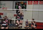 Tipping the ball, junior Jordyn Bloom battled an Augusta player at the net.