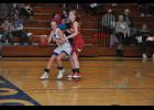 Sophomore point guard Haley Poeschel dribbled past Gilmanton’s Rachel Hovey. Poeschel’s 10 points led a well-balanced offense for the Lady Buffs that saw a total of 10 Mondovi players contribute to the 53-21 decision over the Lady Panthers in their season-opener on Tuesday, Nov. 17.