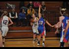 Eyes on the rim, senior Gabby Scott put up a 3-pointer late in the first half.