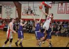 Gilmanton senior Damontae DeWitt soared through the air as he attempted a reverse layup.