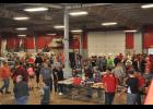 People packed the Cardinal Manufacturing shop during last week’s open house, which offered raffles, a live auction and free food. The event raised about $12,000 to put back into the program.