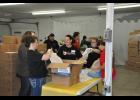 Busily working to prepare food items for pick-up, volunteers separated a big box of frozen pizza crusts. Ruby’s Pantry will be open monthly on the fourth Thursday from 6:30 - 8 p.m. at Harvestime Church.