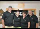 Operating Donna Mae’s Panther Cafe in Gilmanton is truly a family venture for the Davis family. Pictured are Donna and Jamie Davis (right) and their children, Desmond and Karissa. All can be found helping Donna out at the restaurant on nights and weekends.