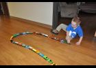 J.J. Grochowski happily pulled a linked line of Thomas the Tank Engine cars along the floor in a hallway at Mondovi’s American Lutheran Communities last week. His dad, Jeff Grochowski, is working to put two train-related world records in his son’s name through the RecordSetter website.