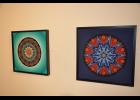 Two of Mary Hermanson’s newer pieces are mounted on colored backgrounds—an aspect she began to explore more recently.