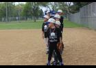 The Alliance Bank 8U team, coached by Chad Dewyre, lined the field as they were announced by deejay Tom Larson, who volunteered his services for the event. “What better way to spend a morning then to make kids feels like super stars,” Larson said. 