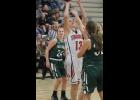 O-F senior captain Sadie Solie rises for a layup over a Cricket defender for two of her 10 points in the victory. 