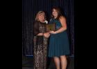 Annie Lisowski (right), Buffalo County 4-H Youth Development Educator, received the Distinguished Service Award presented by Kim Greeley, President of the National Association of Extension 4-H Agents, during the association’s annual awards recognition banquet on Oct. 28. A winner at the state level earlier this year, Lisowski received the national honor for her leadership of the 4-H Community Club program, which promotes positive youth development in several different areas.