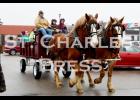 Horse-drawn wagon rides were available to kids and their families during Santa’s visit to the St. Charles Moose Lodge. 