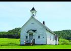 Thanks to the collaborated efforts of three groups, the historic Little Plum Schoolhouse  recently had work completed to help preserve its roof. Photo by Laura Berndt