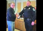 City Council President Steve Schmidt administers the Oath of Office to new police officer Paul Kruger at the Special City Council meeting last Wednesday. 