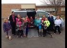 Anna Zarins (center) shared her new wheelchair-accessible van with her second grade class at Mondovi Elementary late last month. The “Anna-Mobile” fundraising effort that began last June is now complete, raising over half of the funds the family needed to cover the nearly $60,000 cost of purchasing the van and installing a conversion and other components to make transporting Anna much easier and safer.