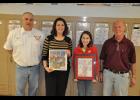 Mondovi fifth-grader Ava Heike (center right) was the grand prize winner of a statewide fire/burn safety student poster contest sponsored in part by the PFFWCF Alliance for Fire Safety. Heike received her award-winning poster in a frame and a $100 Kohl’s gift card from PFFWCF rep Jenna Jordan (center left) on March 18. She was also congratulated by Jim Rud (left) and Steve Anderson (right) of the Mondovi Fire Department.