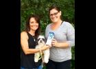 Eleva natives Kim Larsen, left, and Kia Johnson, right, were recently brought together when Johnson was named the winner of a Fitbit Flex through a giveaway opportunity featured on the kimbentley fitness and fashion blog. Larsen started the up-and-coming blog, named for herself and her dog, Bentley (also pictured), in June. She also appears on a regular segment, “Fitness Fashion Fridays,” on WEAU TV-13. 
