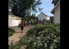 Mondovi High School youths took a time out from their Peak Performance class the morning after the storm to help residents in the Parker Ave. area clear away tree limbs and other debris.