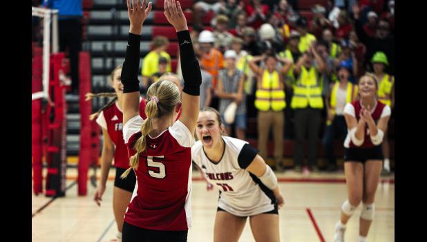 The W-K Falcons celebrate a kill by no. 5 Hailey Arens. Photos by Sophie Horgan