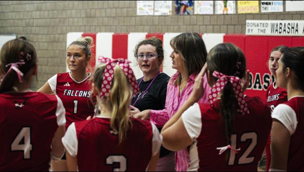 Falcon coach Alliyah Mayhew takes a timeout with her team in the second set against Chatfield. Photos by Sophie Horgan | Editor