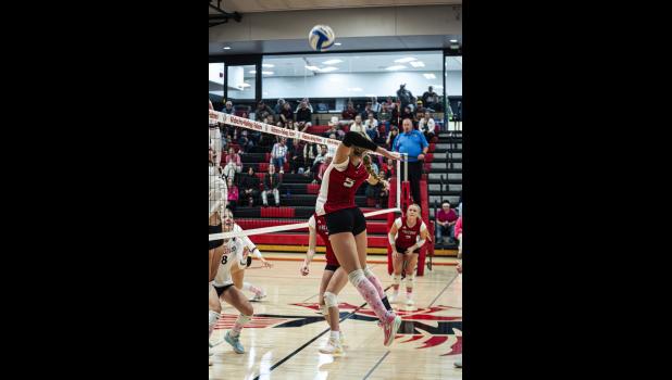 Hailey Arens knocks down a kill against Chatfield.