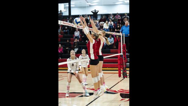 Eve Pavelka gets her hands on a block against the Gophers.