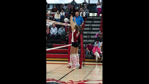 Alaina McCann and Aleaya Becker block the Gophers’ hit.