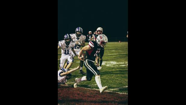 Kevin Wiebusch rushes ahead with the ball until he’s inched out of bounds.