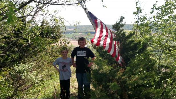 Outdoorsmen Taylor Jesse and Carson Rieck stop for a quick picture during their climb of Mount Tom on May 13.