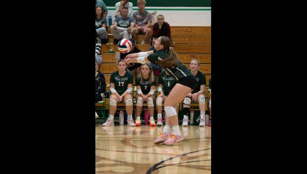 Fall Creek player makes a bump in the backrow. Photo courtesy of Fall Creek Sports History Facebook page