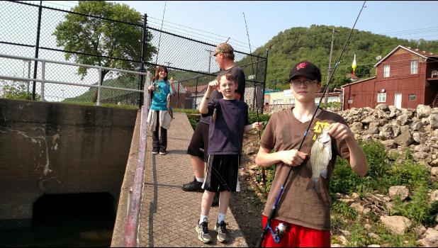 On May 27, the Outdoor Club traveled to Alma for a successful fishing trip experience. Pictured left to right, Julianna Beggs (with her first fish ever), Trevor Lay, Wyatt Clouse and Aaron Sowers.