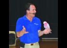 The Birdman with a rose-breasted cockatoo.