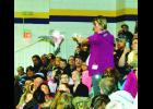 A woman from the crowd gives this rose-breasted cockatoo, which The Birdman had just released,  a dollar bill…which he promptly flew back with to and deposited into a plastic Condor Fund box. The bit was part of the weekend’s Birdman show.