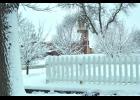 St. Felix Church stands out between the snow-covered tree branches and the picket fence at the Conn and Monica Walters’ residence at East 3rd Street and Bailey Avenue. That’s a lot of snow piled up on the fence and ground nearby—as much as 13 inches fell on the city and area overnight Thursday.—Photos by Michael Smith