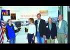 Posing for a group photo with Angel are, from left, handler Jennifer Drayna, Lt. Governor Tina Smith, State Senator Matt Schmit, Wabasha Mayor Rollin Hall and NEC Executive Director Rolf Thompson.